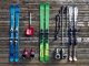 ski equipment -- skis, boots, and deep snow gear against rustic wood panel background