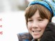 Music while skiing -- boy in winter wear with headphones