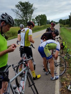 Vail buys Wilmot Moutain -- Cyclists changing a flat tire