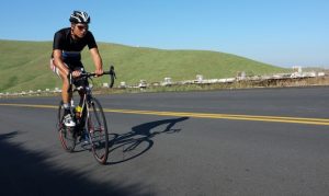Rib Mountain Climb -- man riding a bicycle uphill