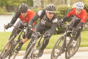 Diablo Criterium 2016 -- three cyclists cornering left.
