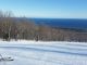 Stay warm skiing -- A skier overlooking Lake Superior at Lutsen Minnesota