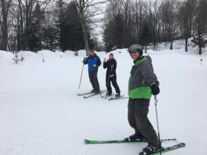 Frist ski trip -- three peoplep posing in their ski gear