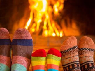 Family in front of the their fireplace